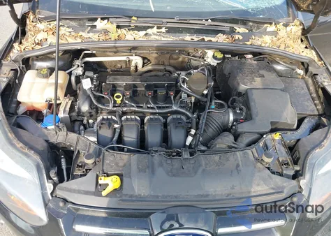 2014 Ford Focus Titanium z USA, uszkodzony, nr VIN 1FADP3J22EL422152